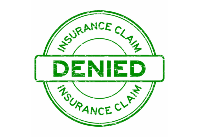 Grunge green insurance claim denied round rubber seal stamp