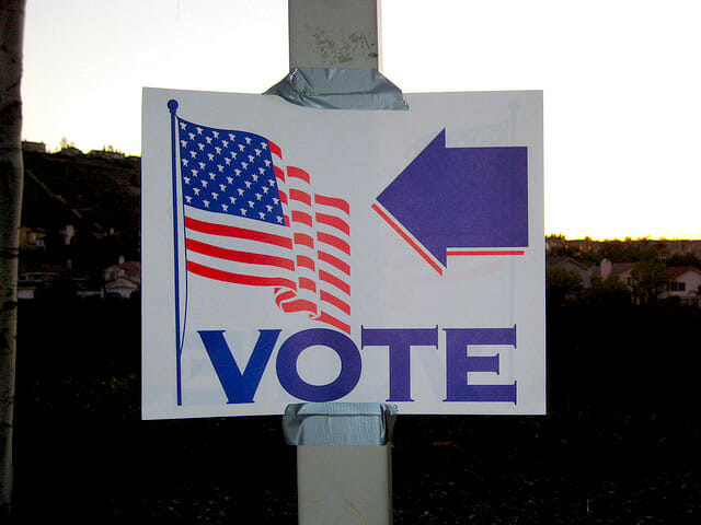 directions to vote american flag sign