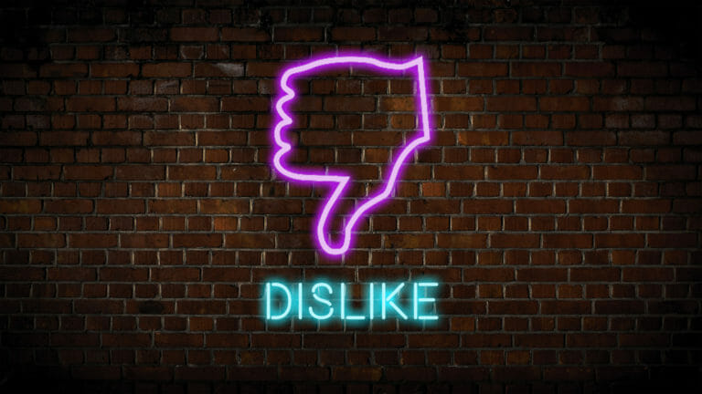 thumbs down neon sign with the word dislike
