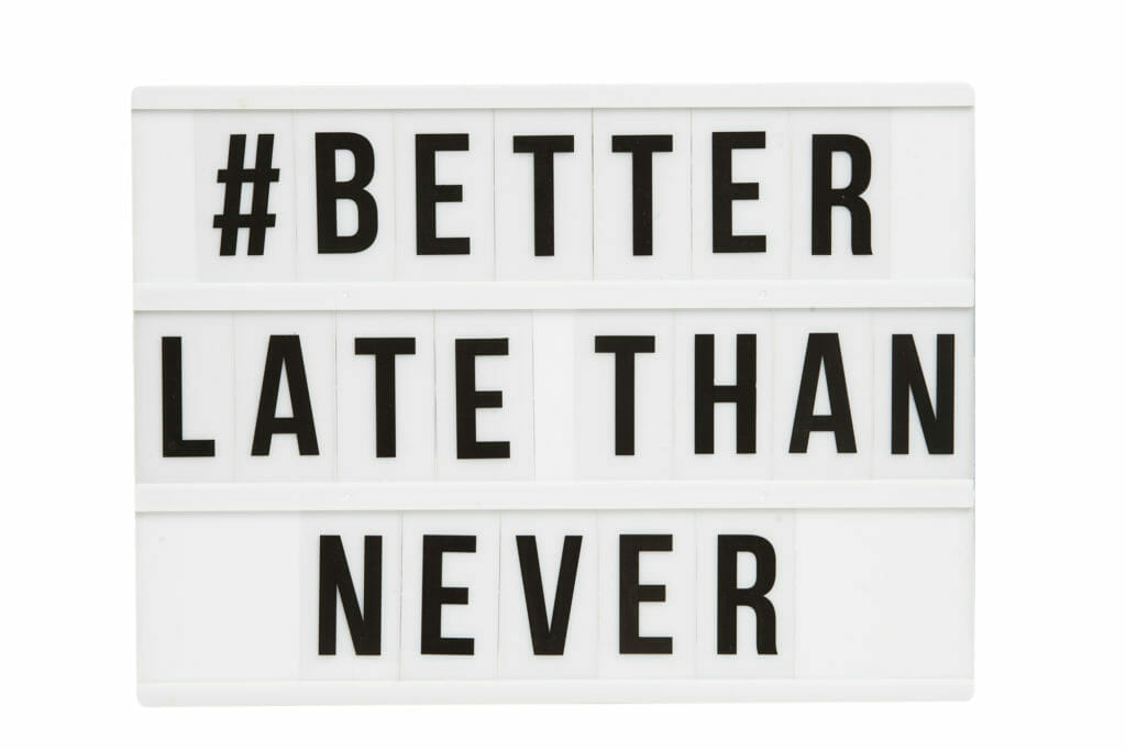 Letter board with #betterlatethannever