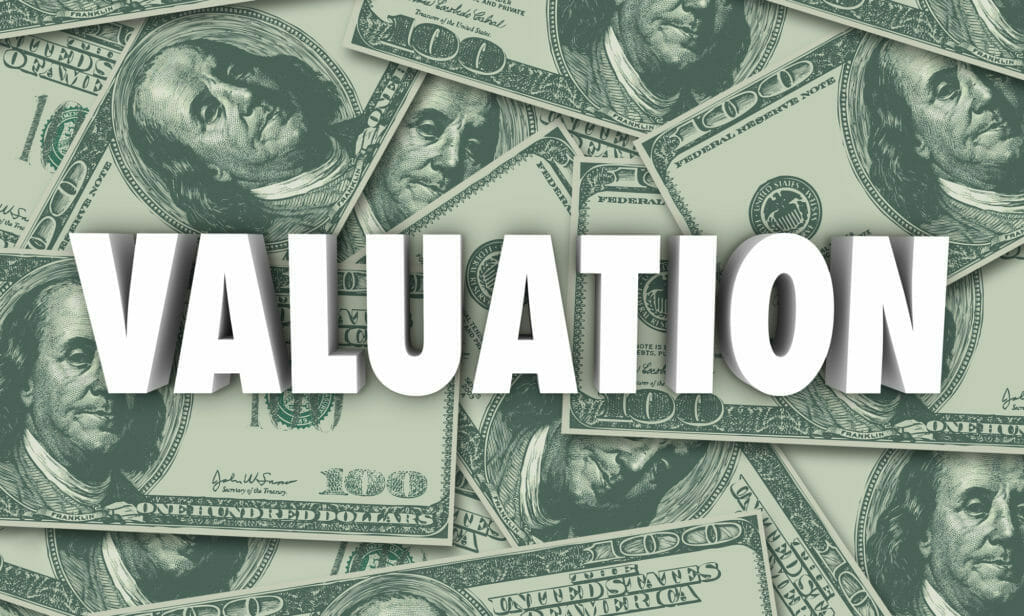 valuation on a background of hundred dollar bills