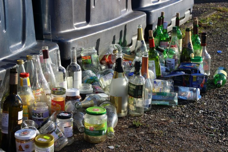 mostly empty bottles and jars on the ground