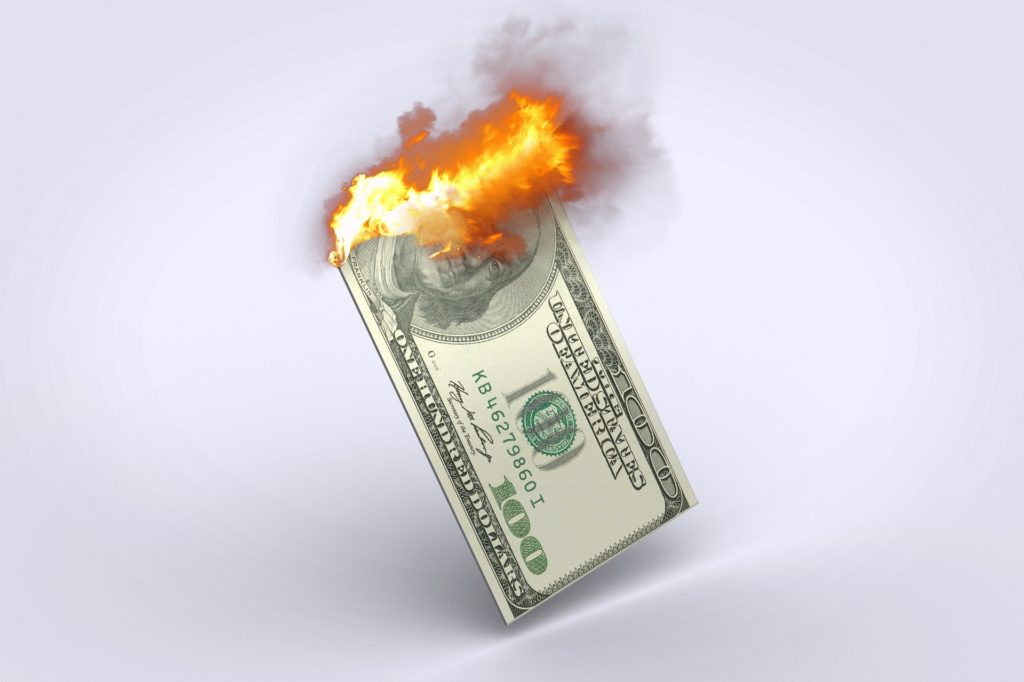 hundred dollar bill on fire