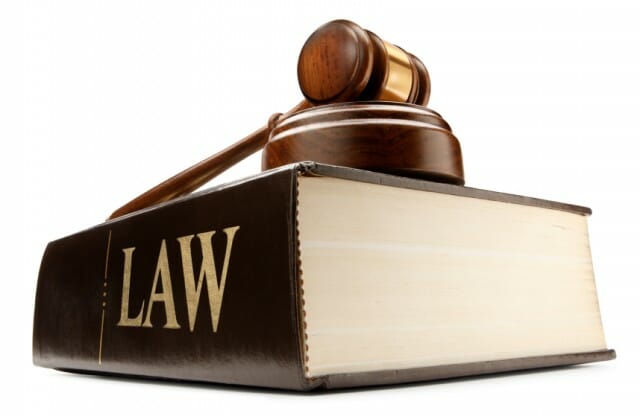 thick law book with gavel